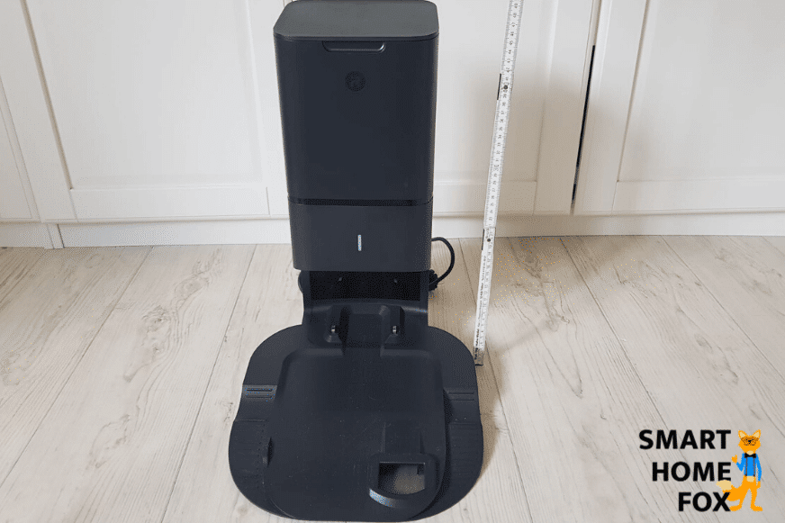 Measuring the Roomba i7+ clean base with ruler